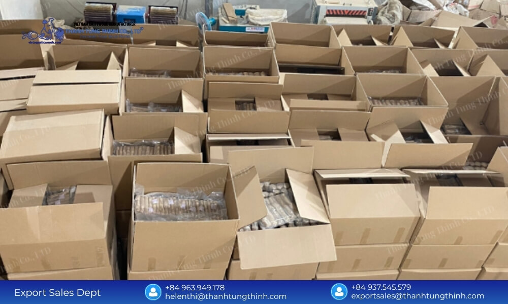 Cardboard boxes filled with high-density wholesale inventory stacked in rows inside a logistics facility