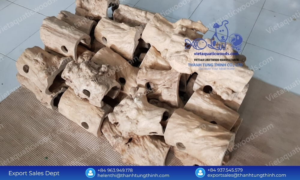 Neatly stacked inventory of premium Coffee Wood Reptile Hideouts undergoing strict quality control at the factory