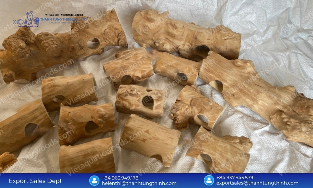 A massive bulk inventory of meticulously carved Coffee Wood Reptile Hideouts ready for wholesale distribution