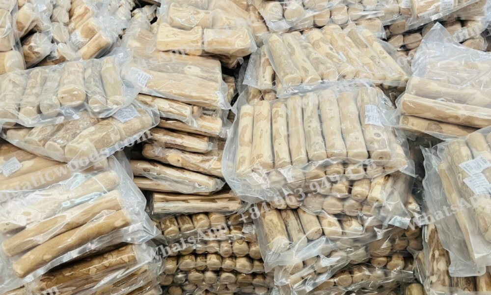 Hundreds of vacuum-sealed wholesale natural wooden dog toys stacked high in the factory warehouse
