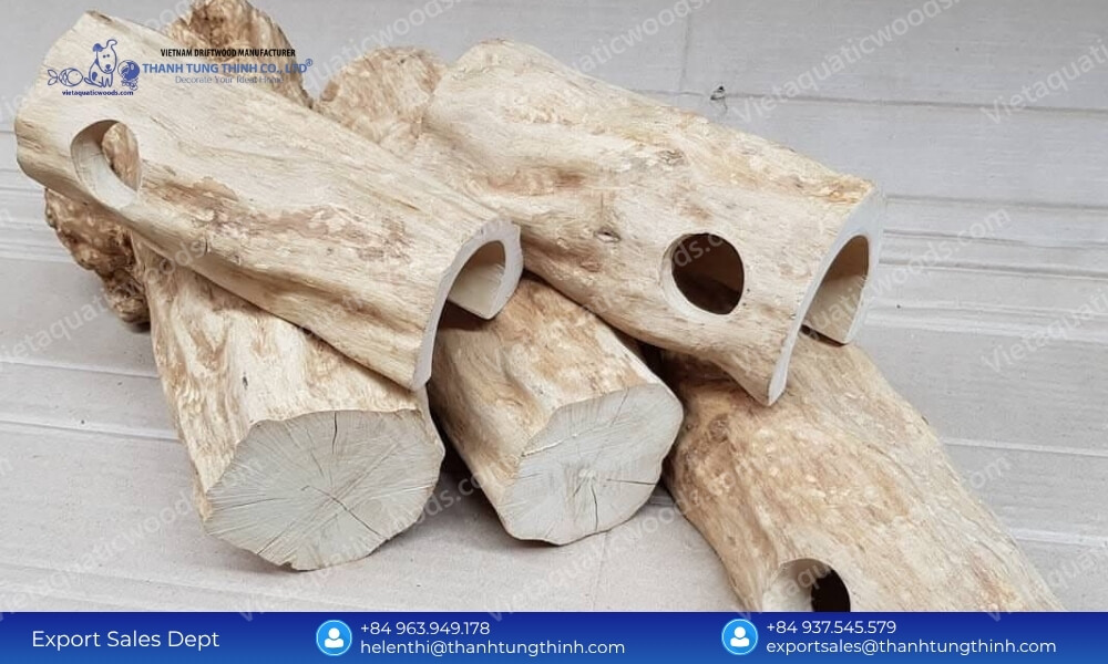 Stacked coffee wood hollow log tunnels illustrating a large scale coffee wood pet products factory capacity
