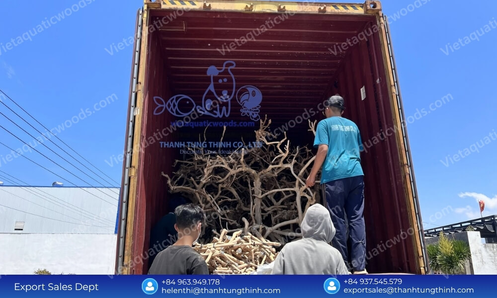 Logistics factory workers loading high-volume shipping container with wholesale pet bird accessories
