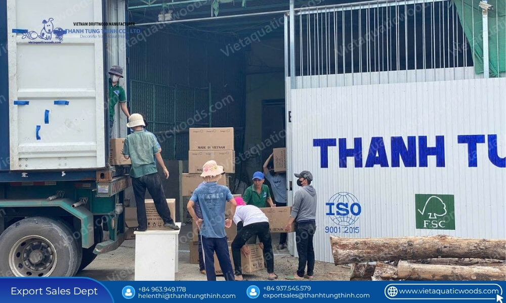 Warehouse workers loading wholesale safety certified coffee wood dog chew bulk containers for export