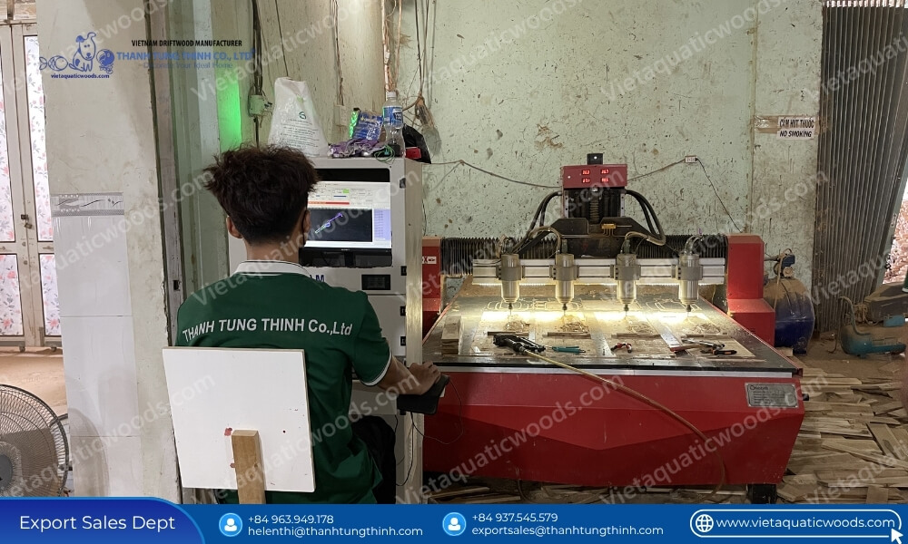 Operator running automated CNC machinery at a bulk pet supplies coffee wood chew manufacturing plant