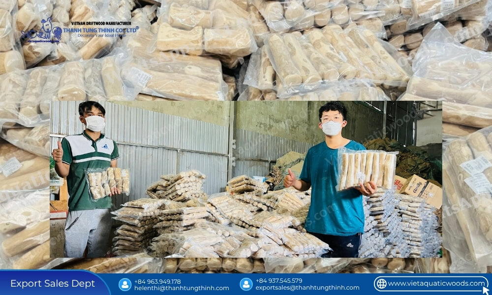 Warehouse staff showing packaged products at a bulk pet supplies coffee wood chew inventory facility