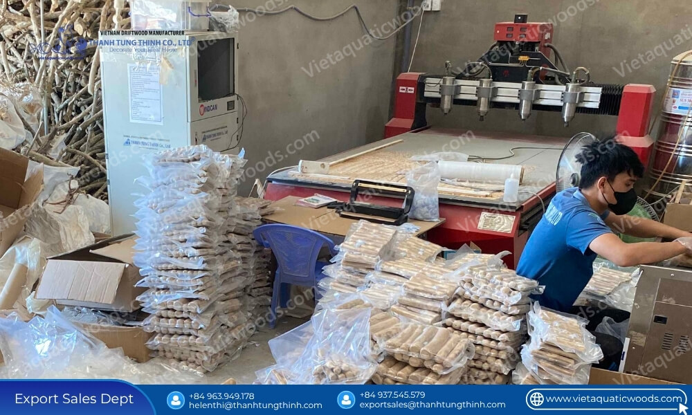 Factory processing line with a worker vacuum sealing products from a coffee wood dog chew bulk container supplier