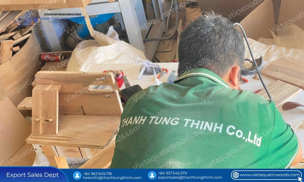 Skilled craftsman at ThanhTungThinh factory processing premium timber for large scale wooden pet house supply chain stability